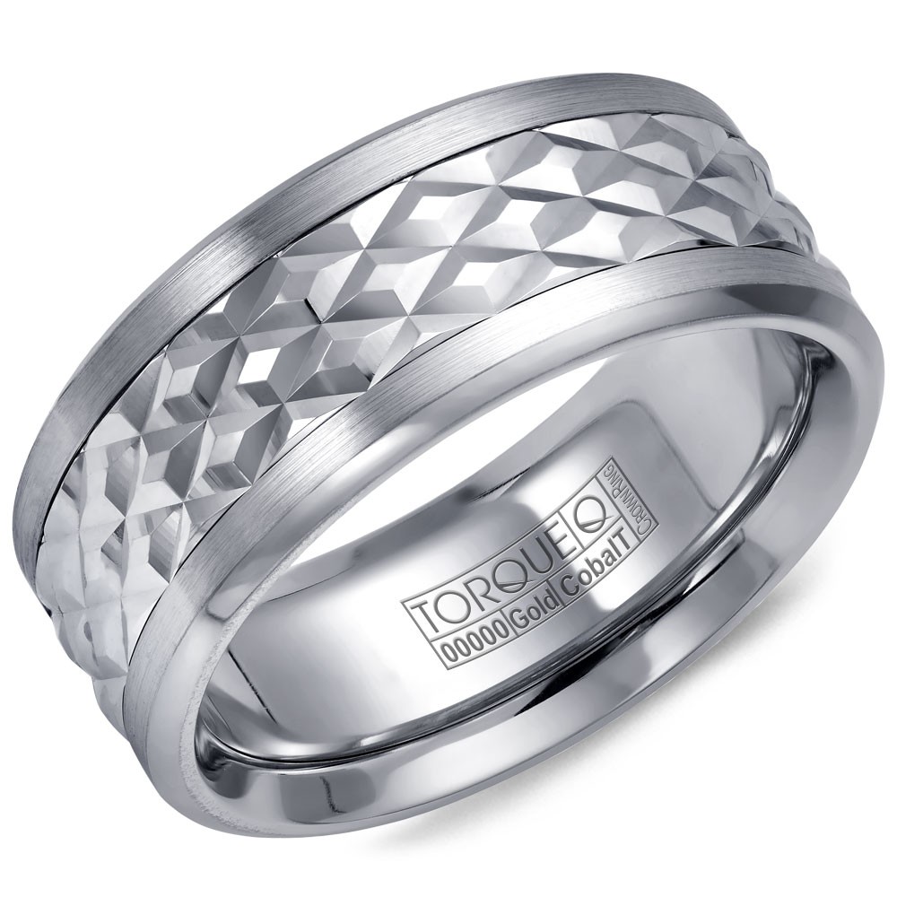 A Torque Ring In White Cobalt With A Carved Patterened White Gold Center.