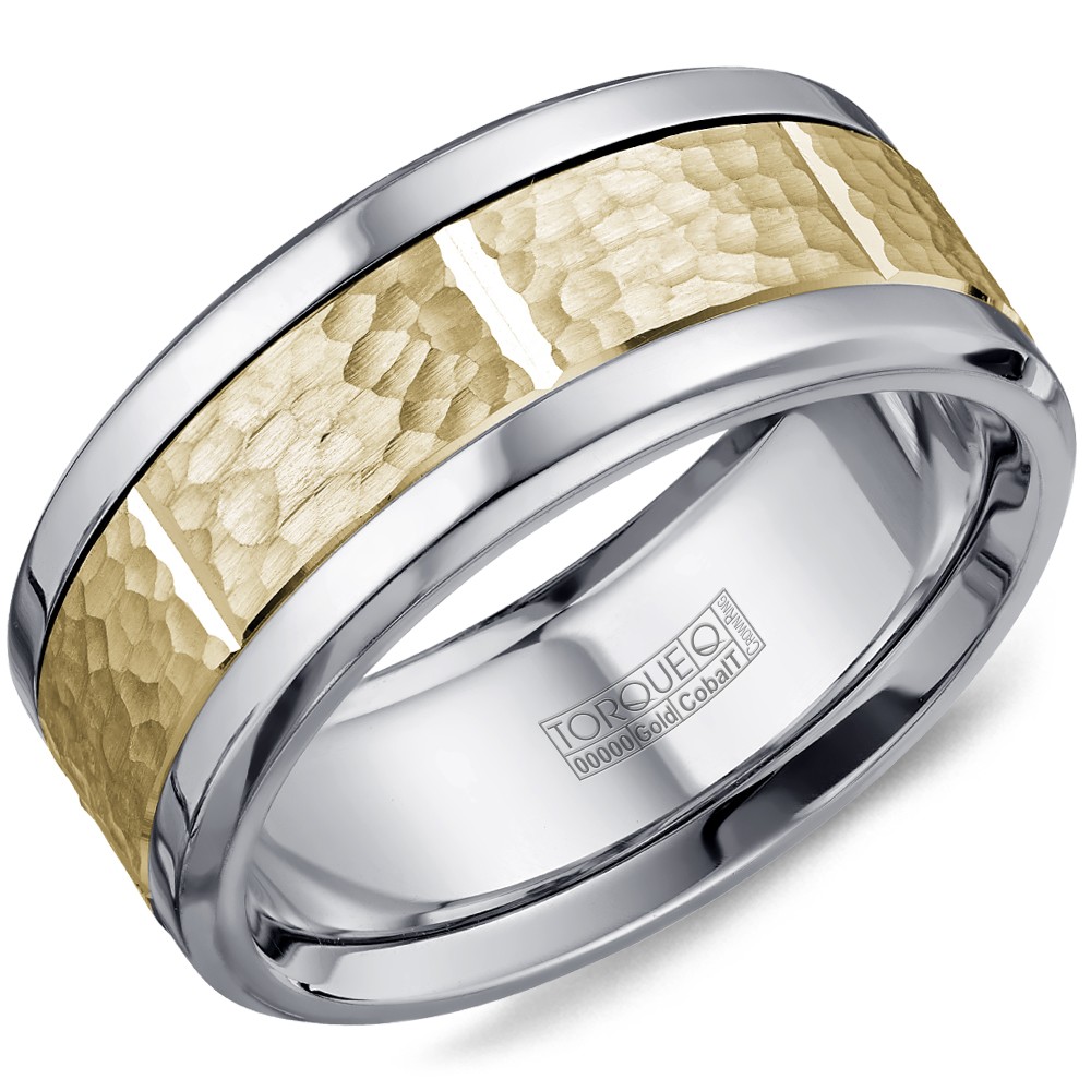 A Torque Ring In White Cobalt With A Hammered Yellow Gold Center And Notch Detailing.