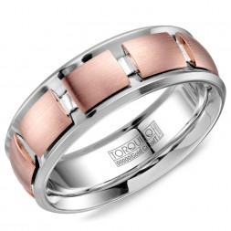 A Torque Ring In White Cobalt With A Rose Gold Geometric Pattern Inlay.