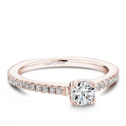 A Carver Studio rose gold engagement ring with 23 diamonds.