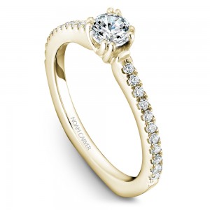 A Carver Studio yellow gold engagement ring with 23 diamonds.