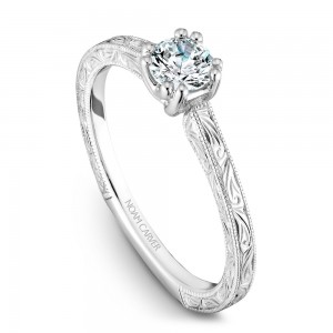 A Carver Studio engraved white gold engagement ring with a round center stone.