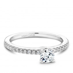 A solitaire Carver Studio white gold engagement ring with 23 diamonds.