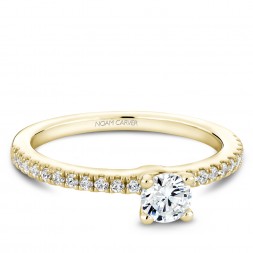 A solitaire Carver Studio yellow gold engagement ring with 23 diamonds.