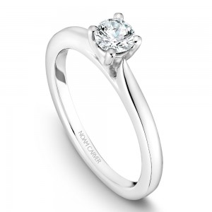 A solitaire Carver Studio white gold engagement ring with a round center stone.