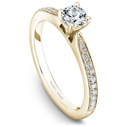 A solitaire Carver Studio yellow gold engagement ring with a round center stone and 23 diamonds.