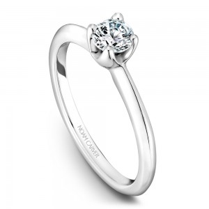 A floral Carver Studio white gold engagement ring with a round center stone.