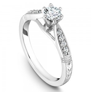 A vintage Carver Studio white gold engagement ring with 9 diamonds.