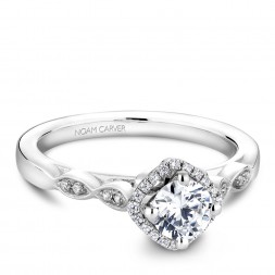 A floral Carver Studio white gold engagement ring with 29 diamonds.
