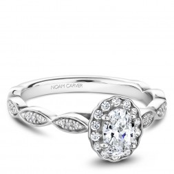 A Carver Studio white gold engagement ring with an oval floral halo and 39 diamonds.