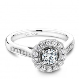 A floral Carver Studio white gold engagement ring with 27 diamonds.