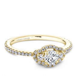 A 3-stone Carver Studio yellow gold engagement ring with 47 diamonds.
