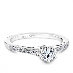 A modern Carver Studio white gold engagement ring with 23 diamonds.