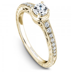 A Carver Studio yellow gold engagement ring with 17 diamonds.