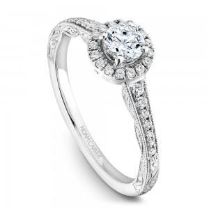 A vintage Carver Studio white gold engagement ring with a halo and 33 diamonds.