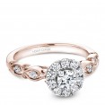 A floral Carver Studio white and rose gold engagement ring with a halo and 17 diamonds.