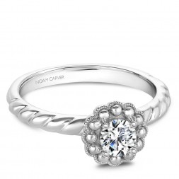 A floral Carver Studio white gold engagement ring with a round center stone.