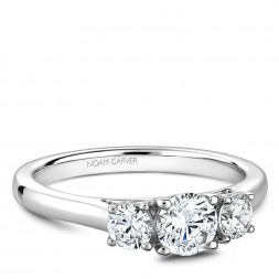 A 3-stone Carver Studio white gold engagement ring.