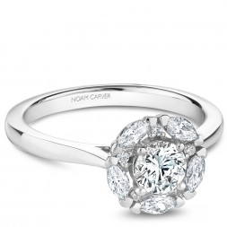 A modern Carver Studio white gold engagement ring with 11 diamonds.