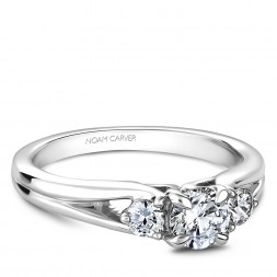 A 3-stone Carver Studio white gold engagement ring.