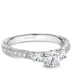 A vintage 3-stone Carver Studio white gold engagement ring with 15 diamonds.
