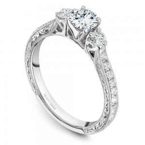 A vintage 3-stone Carver Studio white gold engagement ring with 15 diamonds.