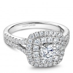 A modern Carver Studio white gold engagement ring with a double halo and 69 diamonds.