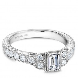 A vintage Carver Studio white gold engagement ring with 16 diamonds.